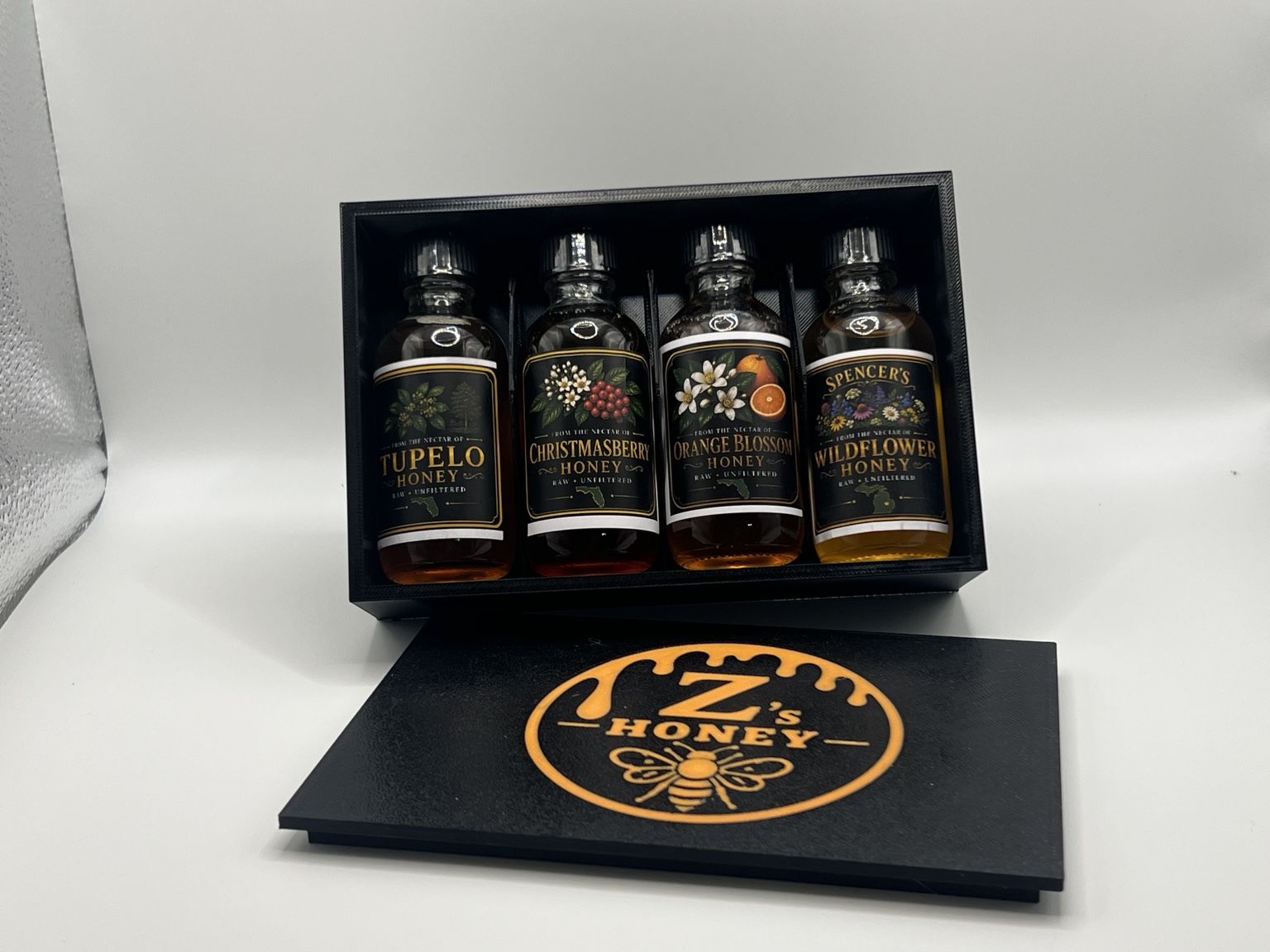 Open Genesis Version 1 collection box with four honey jars