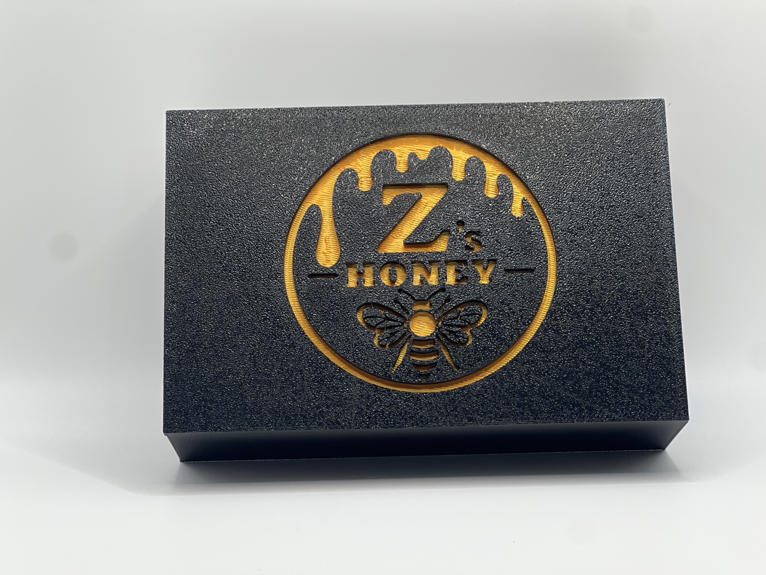 Closed Genesis Version 2 collection box with gold recessed seal
