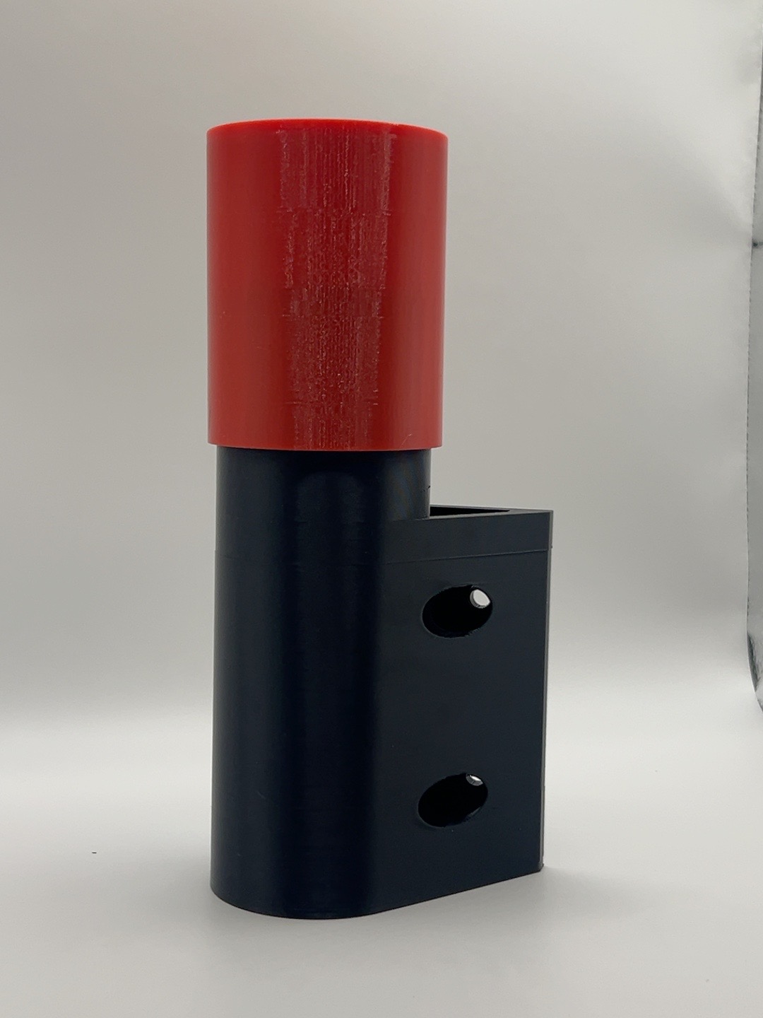 Black and red mounted bug spray holder